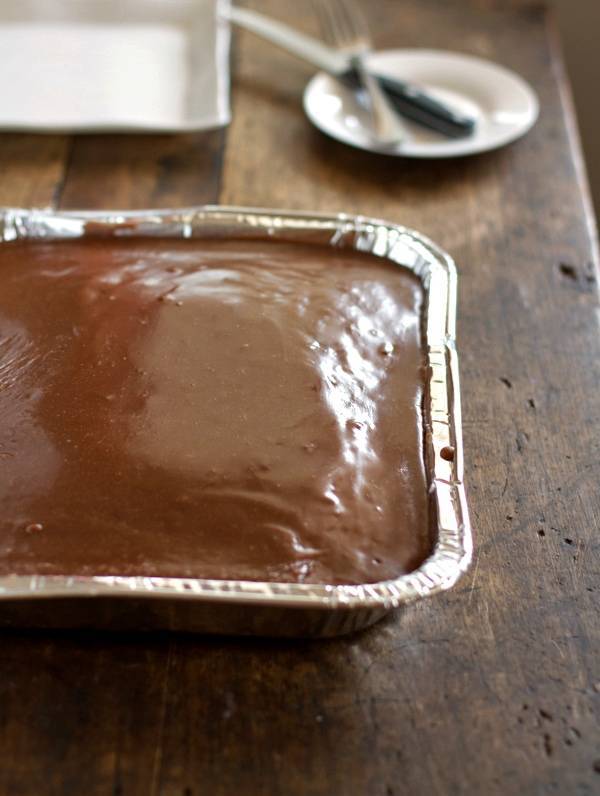 Chocolate oatmeal cake with fudge frosting in a tin.