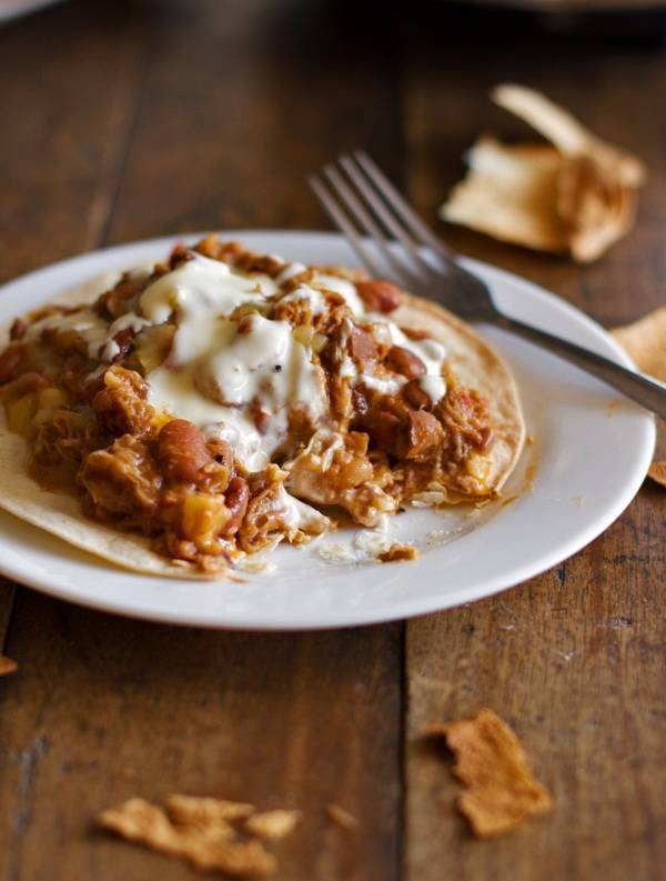 Crockpot chalupas on a plate with a fork.
