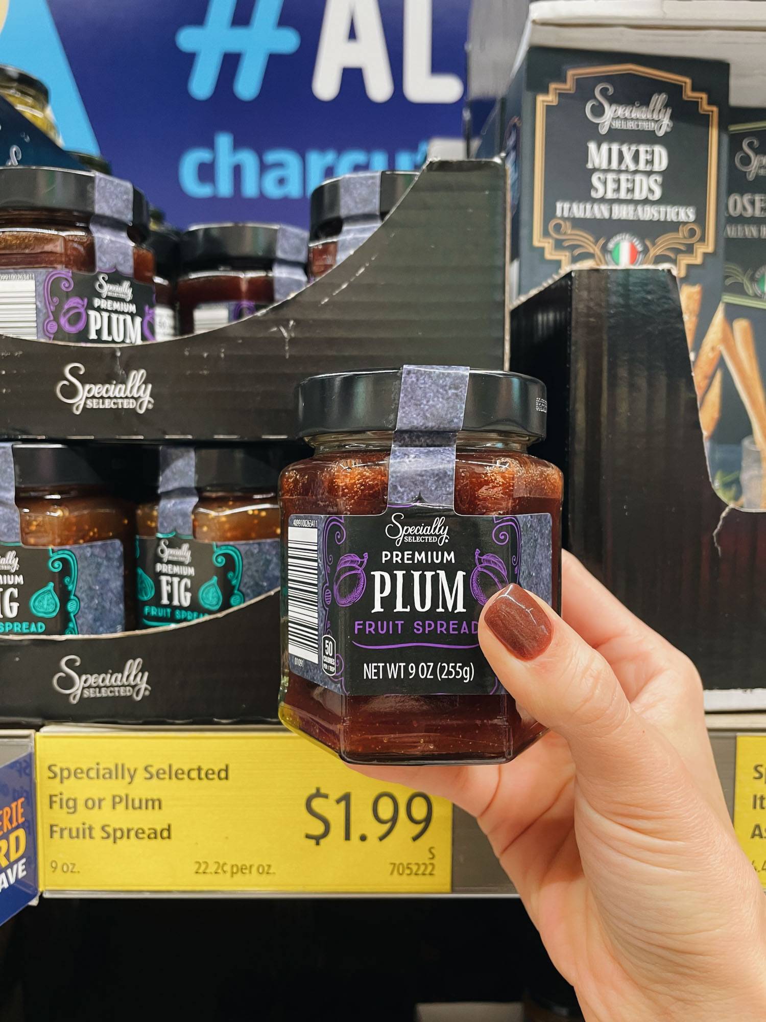 White hand holding plum sauce