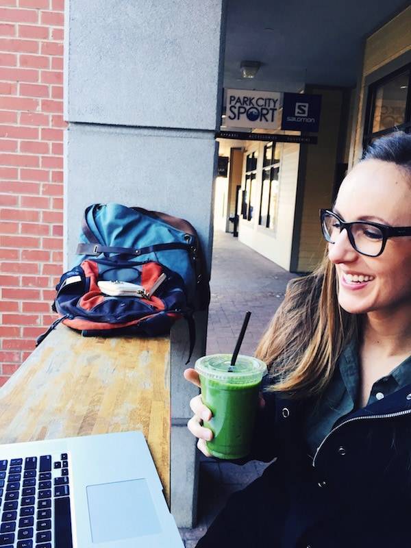 Woman drinking a green smoothie.