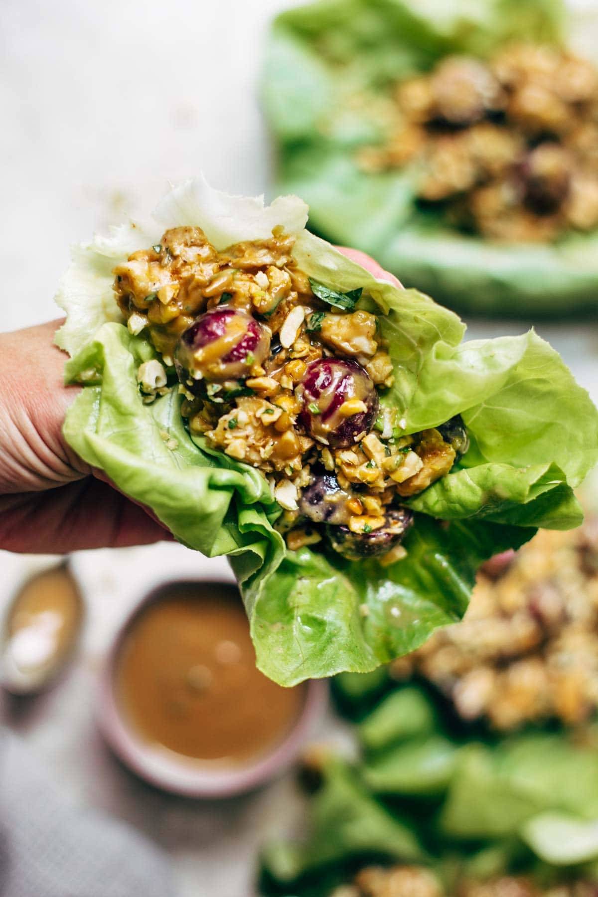 Creamy Miso Peanut Chicken Lettuce Wraps - grilled chicken and juicy grapes tossed with a simple creamy miso-peanut sauce. Super easy and healthy recipe! | pinchofyum.com